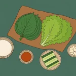 An open tray of leaves, rice and simple fillings presents the flexible ingredients of ssam culture.